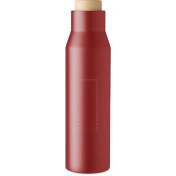 delante de la botella